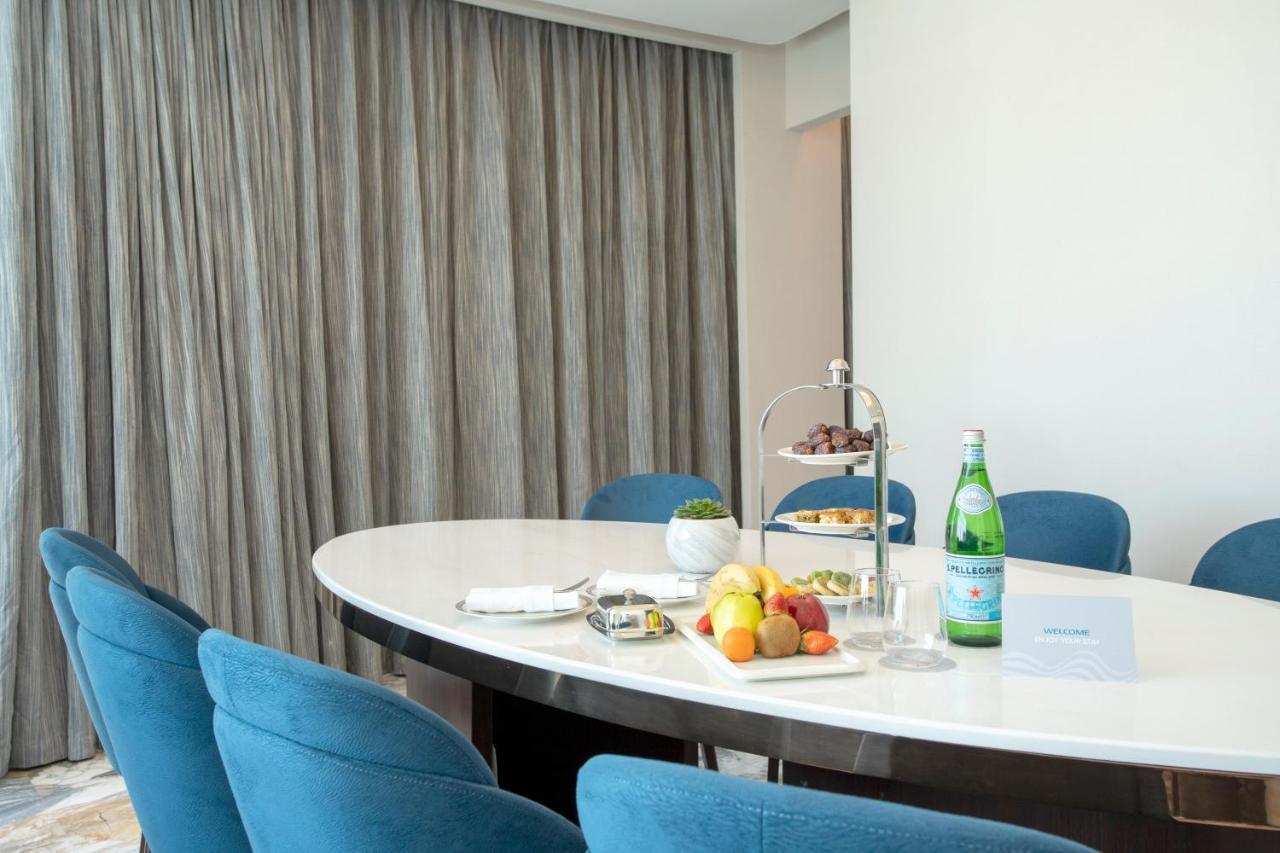Century Marina Hotel - Lusail Экстерьер фото A table with a bottle of mineral water