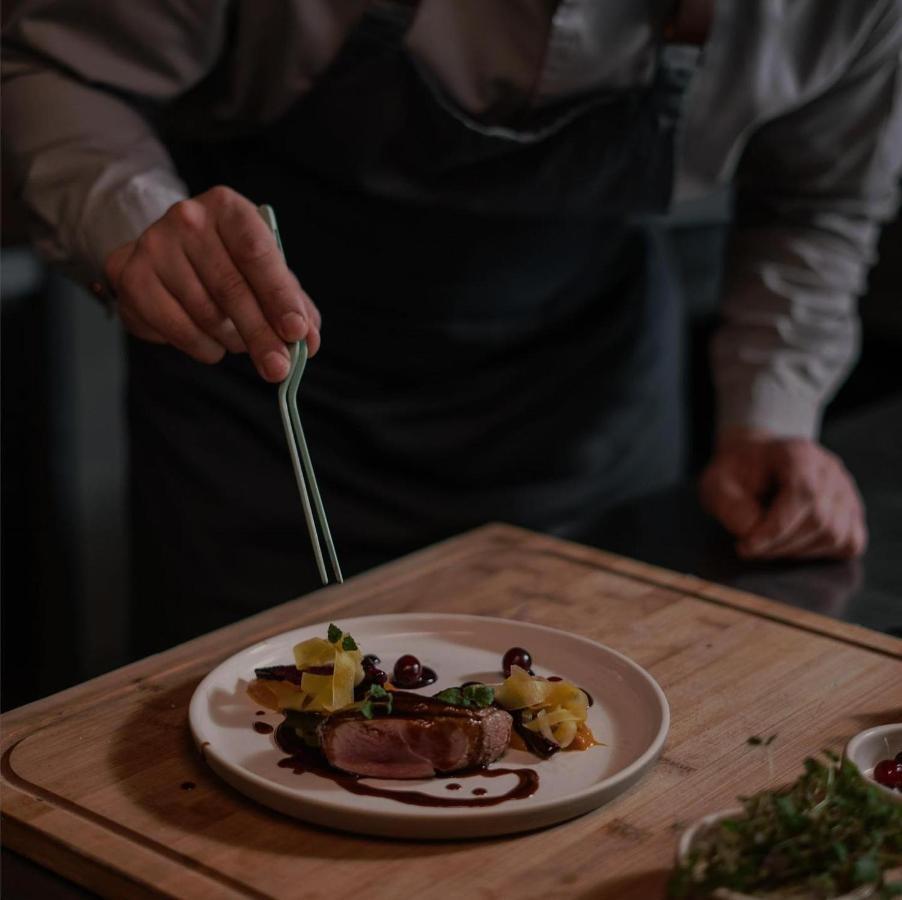 Century Marina Hotel - Lusail Экстерьер фото A chef plating a dish